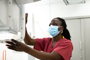 A female member of staff sets up an xray machine