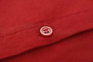 Red button on a red shirt Red button on a red shirt